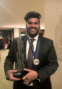 Ravi Teja Bijinepalli holding Autocar challenge Trophy